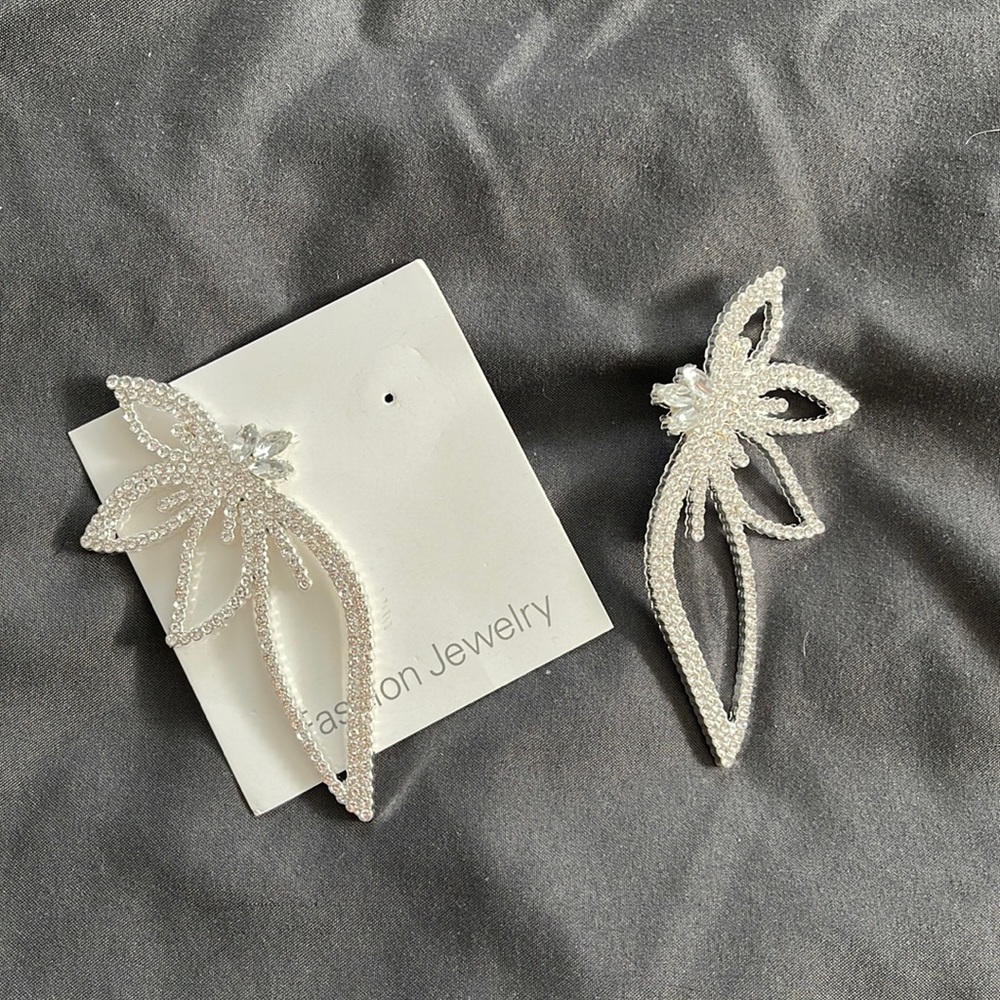 New. Lovely earrings with rhinestones. Top to bottom is 3 1/5 in. Very stylish.